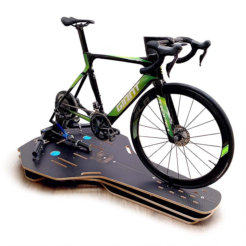 Omnirocker full-motion cycling rocker plate with Wahoo Kickr turbo trainer. Side view, Stealth finish.