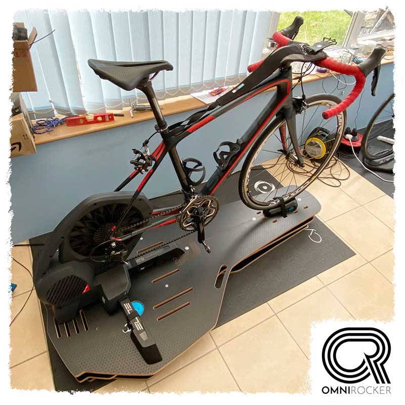 Omnirocker rocker plate for Elite Direto turbo trainer. Paincave setup, Stealth finish.