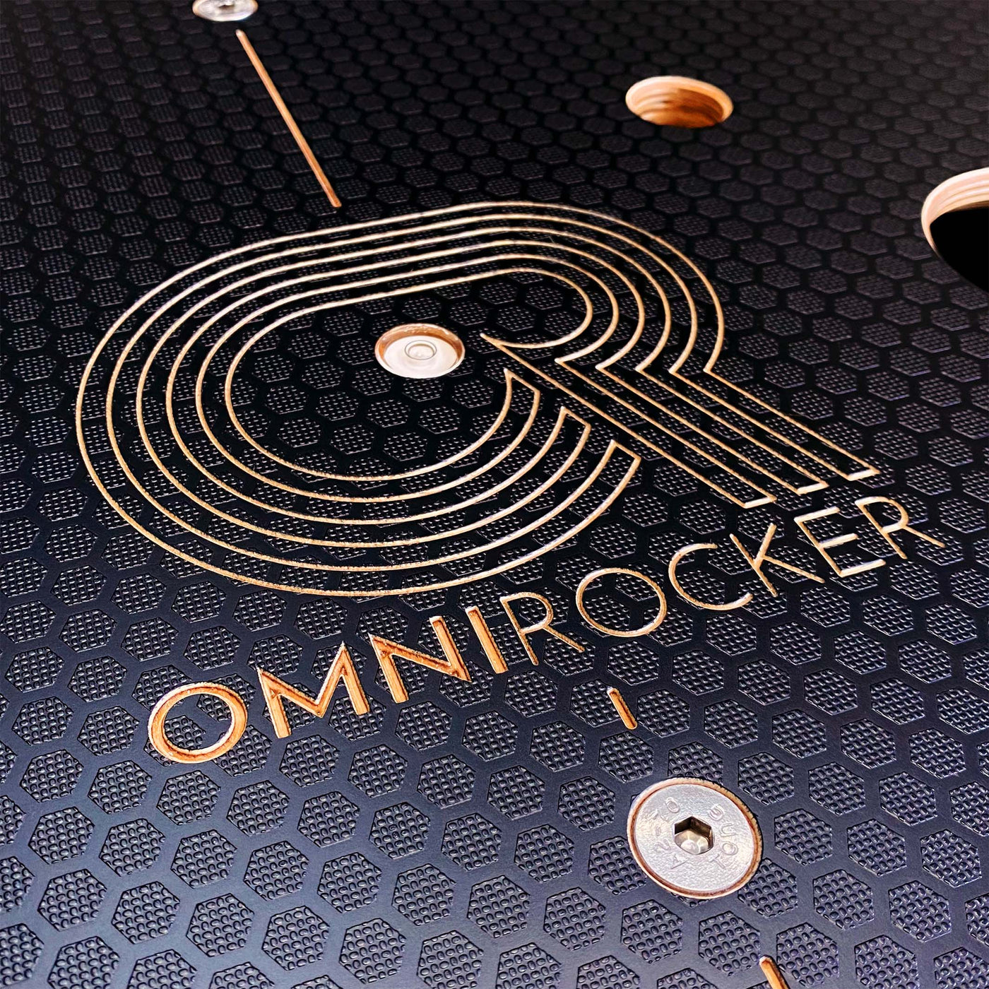 Omnirocker Lite rocker plate for the Wahoo Kickr smart bike. Logo detail, Stealth finish.